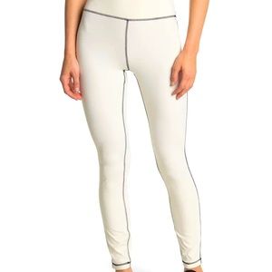 WeWoreWhat leggings new with tags. Size medium. Cream with black stitching.